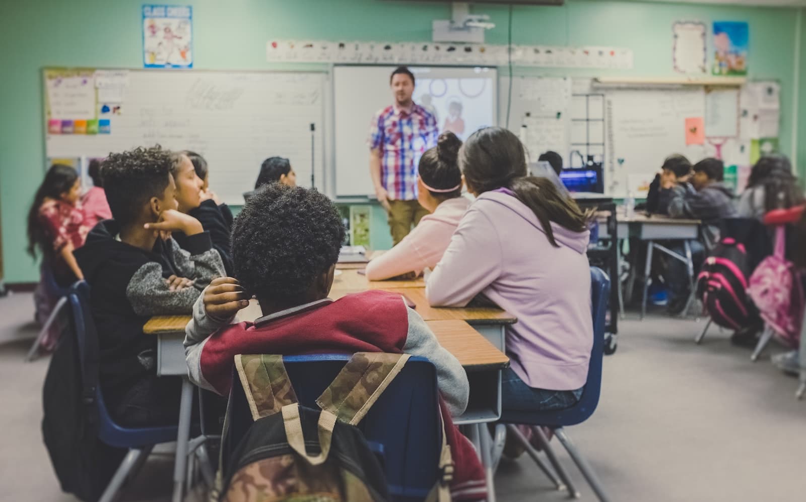 A teacher leading a classroom of students